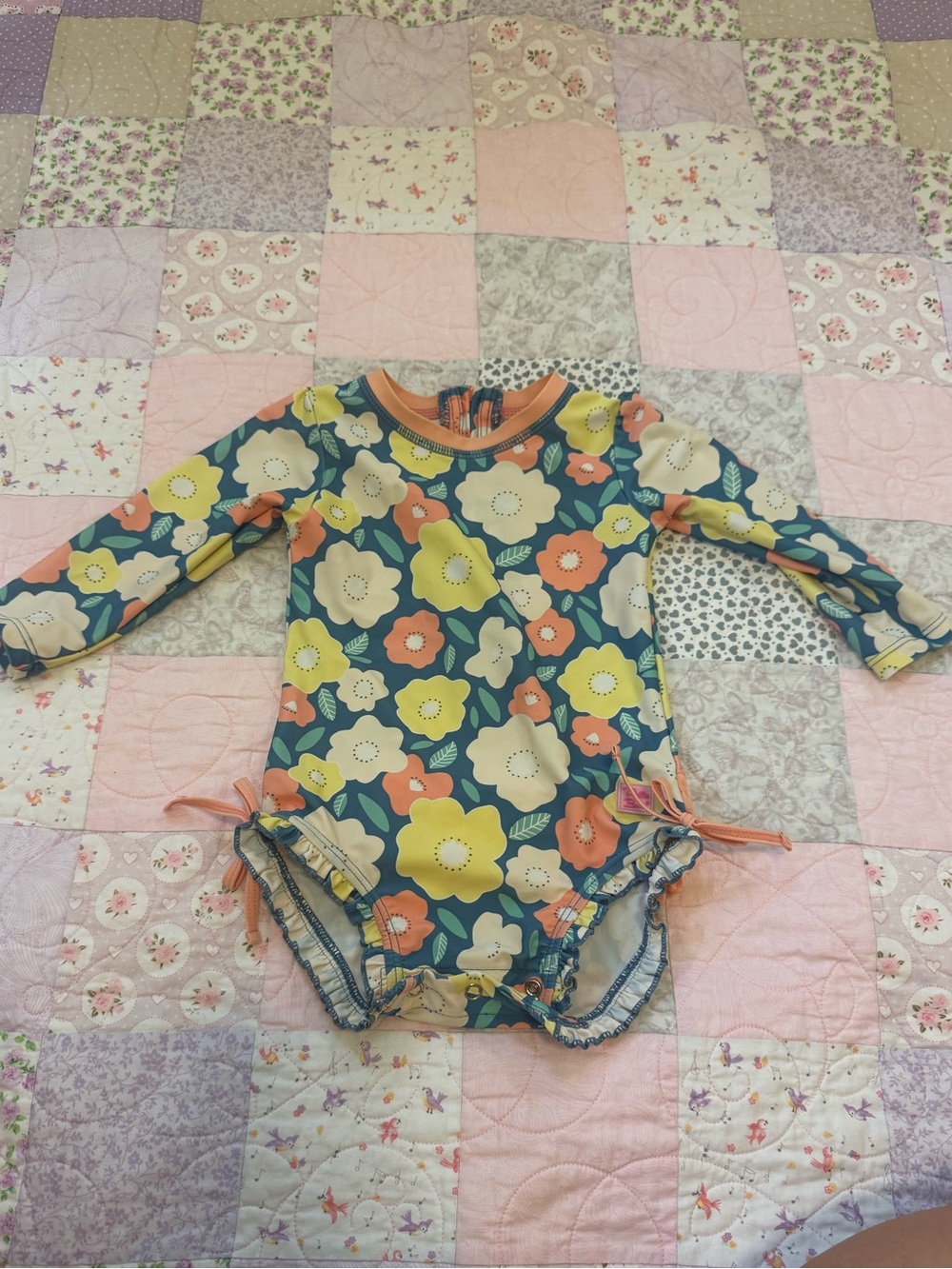 Ruffle Butts Floral Long-Sleeve One-Piece with Yellow & Coral Flowers